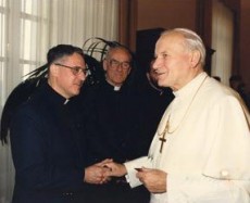 Fr. Donat Lamothe (left) meets Pope John Paul II for the first time in 1986. Fr. Wilfrid Dufault, A.A. can be seen in the background